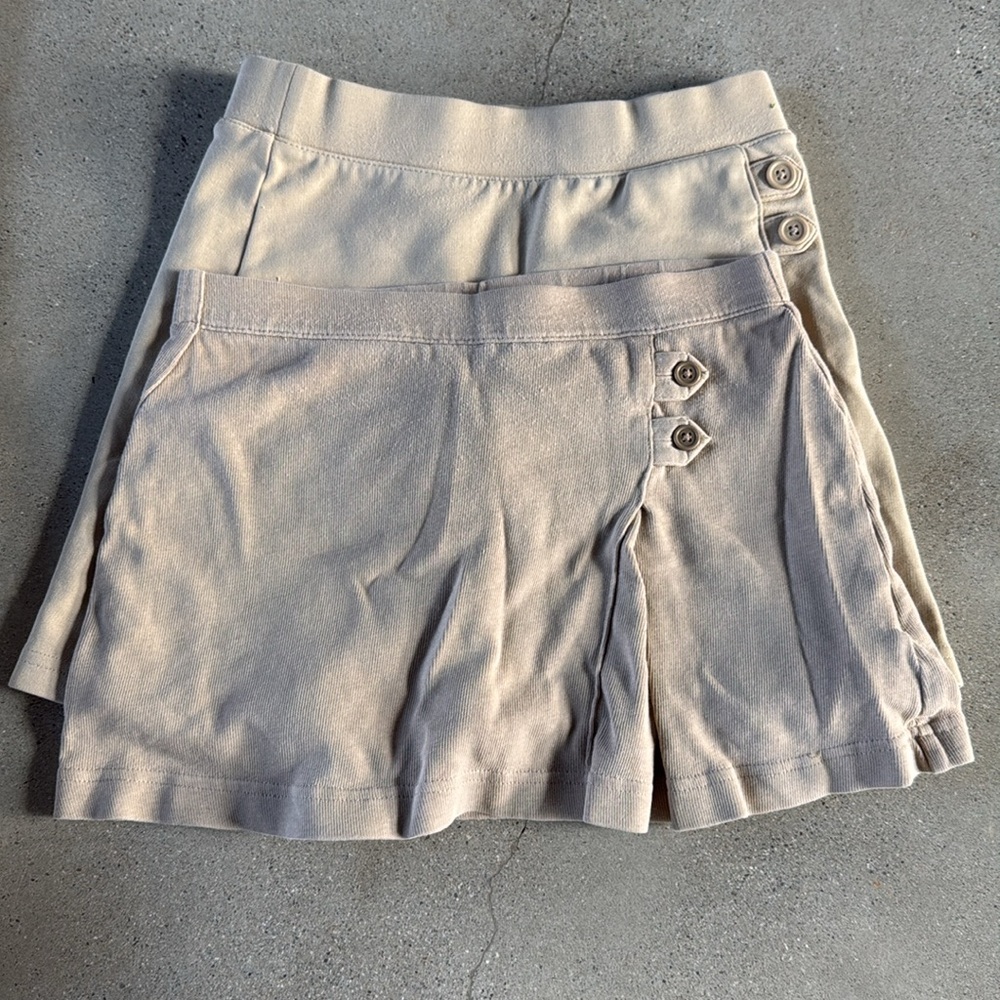 Girls size 6 bundle. Includes 2 uniform skirts, 2 dresses and a skort.